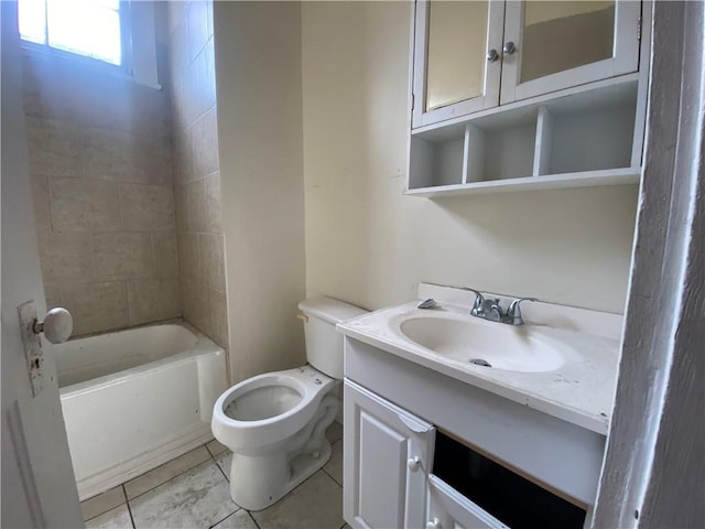 bathroom with tile patterned flooring, vanity, and toilet