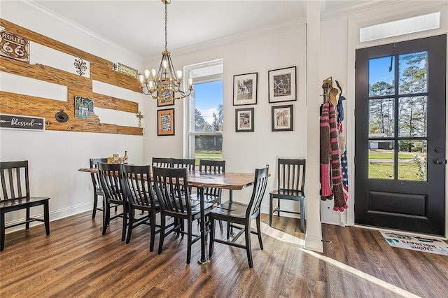 dining room with a chandelier, dark hardwood / wood-style floors, and crown molding