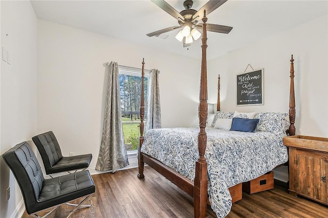 bedroom with a ceiling fan and dark wood finished floors