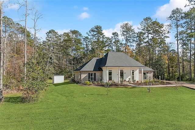 rear view of property featuring a yard