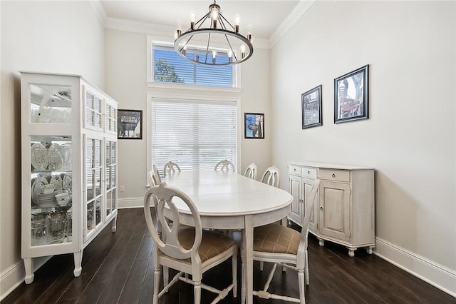 dining area with crown molding, dark hardwood / wood-style flooring, an inviting chandelier, and french doors