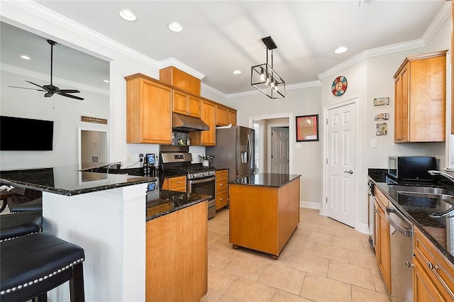 kitchen featuring appliances with stainless steel finishes, dark stone counters, hanging light fixtures, a center island, and kitchen peninsula