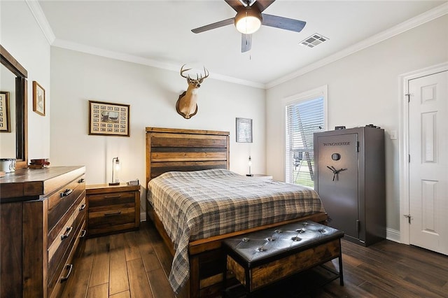 bedroom with dark hardwood / wood-style flooring, crown molding, and ceiling fan