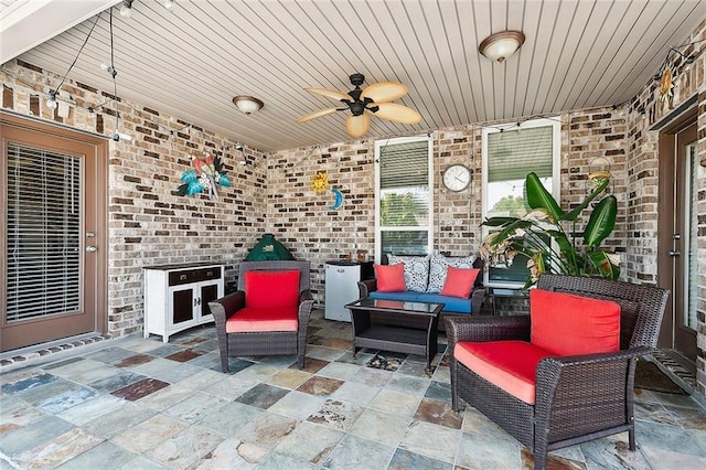 view of patio with outdoor lounge area and ceiling fan