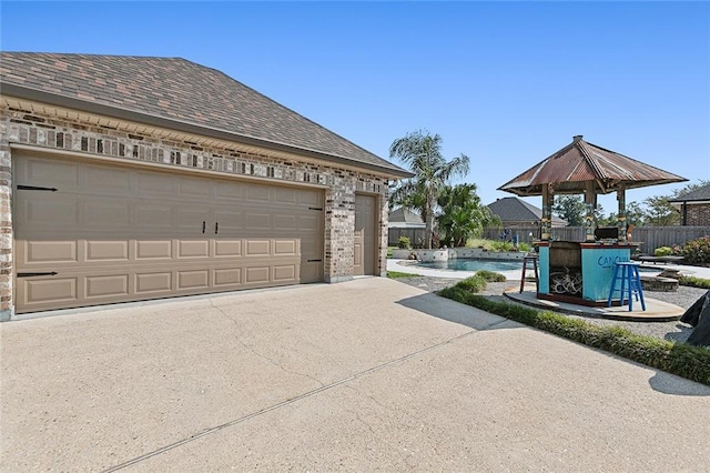 garage with a fenced in pool