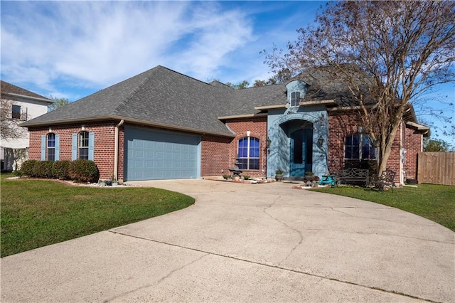 view of front facade featuring a garage and a front lawn