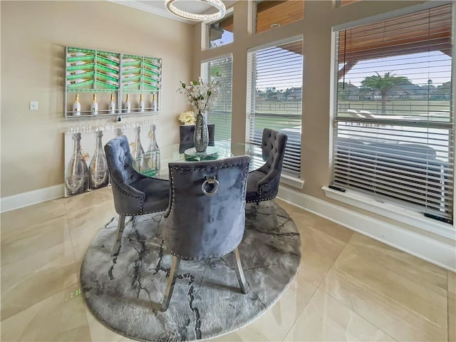 tiled dining room with crown molding