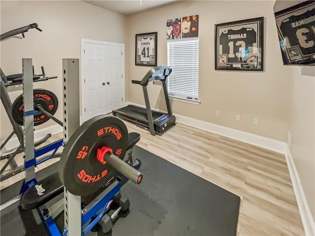 workout area with wood-type flooring