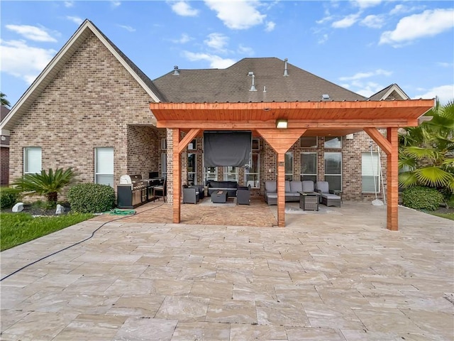 back of property featuring an outdoor living space, a patio area, a pergola, and an outdoor kitchen