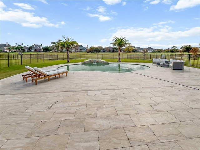 view of pool with a lawn, an outdoor hangout area, and a patio