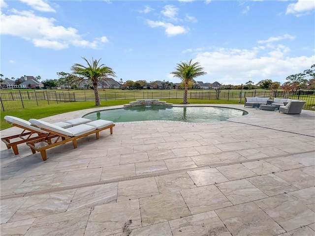 view of pool with a lawn, a patio area, outdoor lounge area, and pool water feature