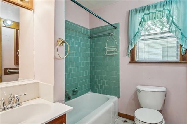 full bathroom featuring vanity, toilet, and tiled shower / bath