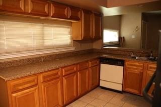 168 Prairieveiw Ct, Avondale, LA 70094 - kitchen with white dishwasher, light tile patterned flooring, brown cabinets, and a sink