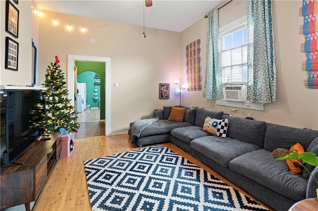 living room featuring ceiling fan and light wood-type flooring