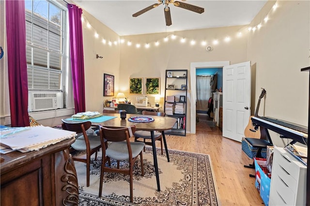 dining area featuring ceiling fan, light hardwood / wood-style flooring, and cooling unit