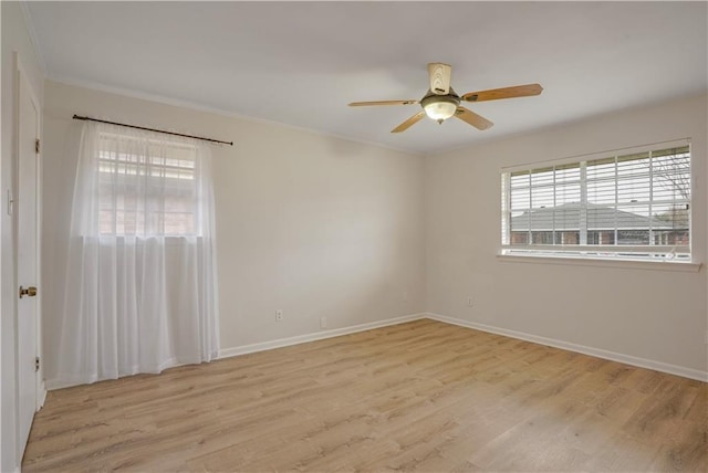 empty room featuring ceiling fan and light hardwood / wood-style floors