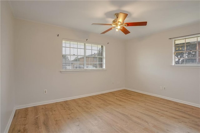 unfurnished room featuring light hardwood / wood-style flooring and ceiling fan