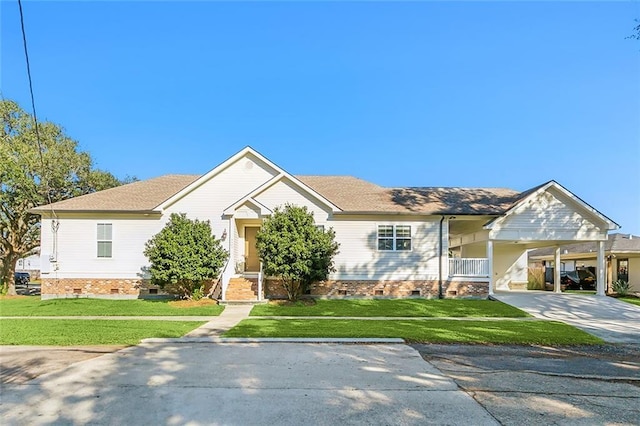 ranch-style house with a front yard and a carport