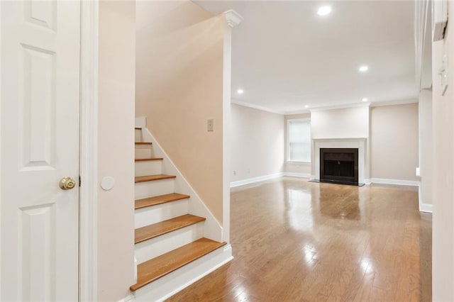 interior space featuring hardwood / wood-style flooring and ornamental molding