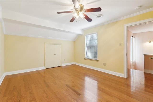 bonus room featuring light wood-type flooring, ceiling fan, and lofted ceiling