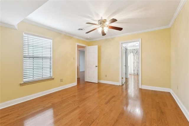 unfurnished room with ceiling fan, hardwood / wood-style floors, and ornamental molding