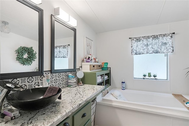 bathroom featuring a bath and vanity