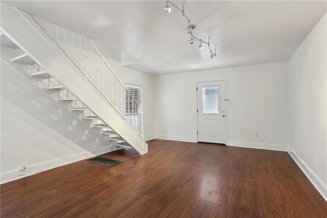 foyer featuring dark wood-type flooring