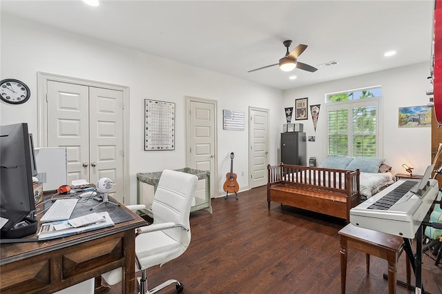 office area featuring dark hardwood / wood-style floors and ceiling fan