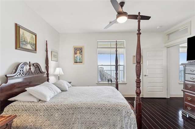 bedroom with ceiling fan and dark hardwood / wood-style flooring