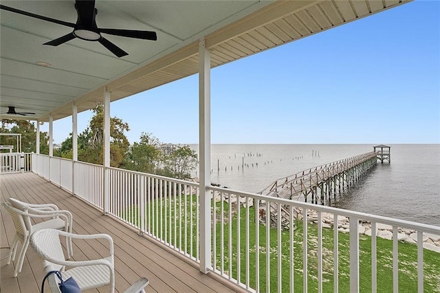 wooden deck featuring a water view