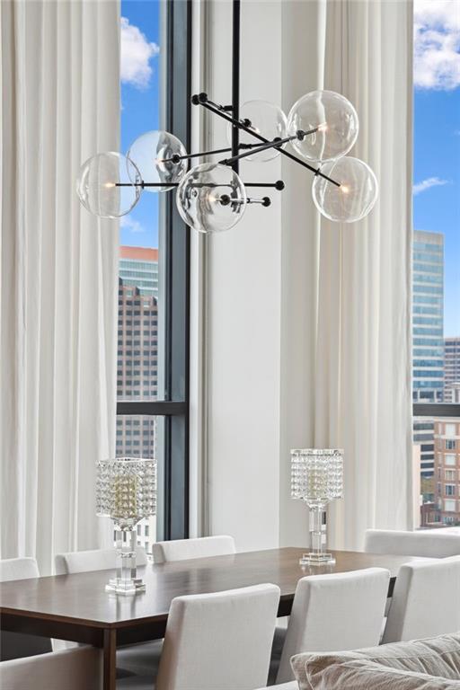 dining area with an inviting chandelier