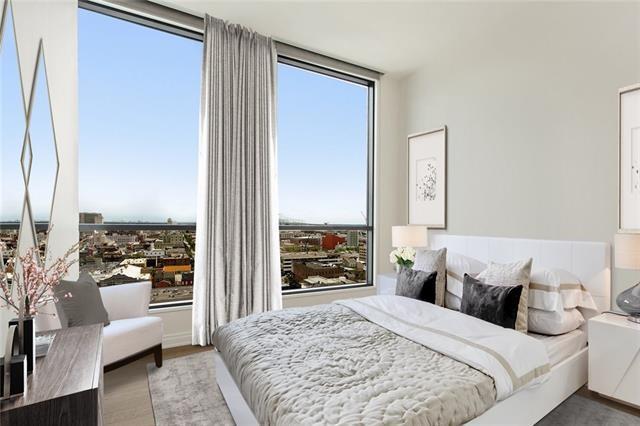 bedroom with floor to ceiling windows