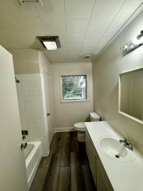 full bathroom with vanity, toilet, and shower / tub combination