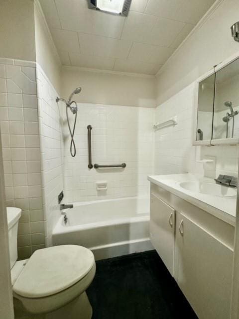 full bathroom featuring vanity, toilet, and tiled shower / bath combo