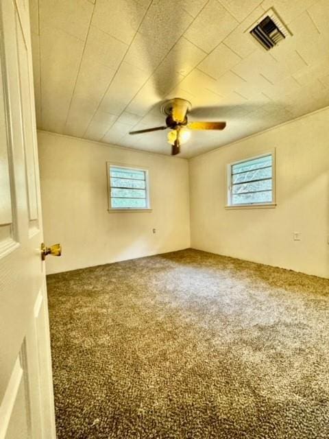 carpeted empty room with ceiling fan