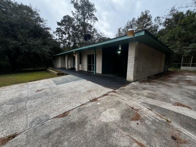 exterior space with a carport