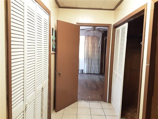 hall with light tile patterned floors