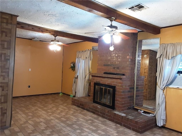 unfurnished living room with beam ceiling, ceiling fan, a brick fireplace, and a textured ceiling