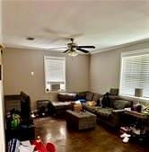 living room with ceiling fan