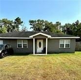 ranch-style home with a front yard