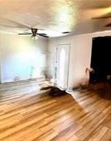 interior space with hardwood / wood-style floors and ceiling fan