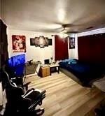 bedroom featuring hardwood / wood-style floors and ceiling fan