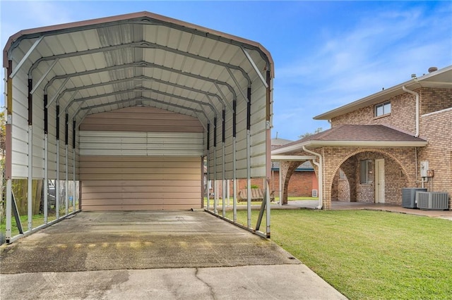 view of parking / parking lot featuring a carport and a yard