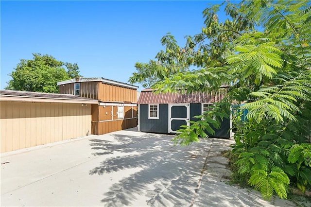 view of patio / terrace with a shed