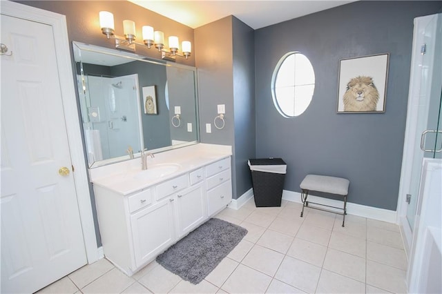 bathroom featuring tile patterned floors, vanity, and an enclosed shower