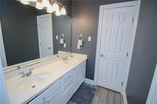 bathroom featuring hardwood / wood-style floors and vanity