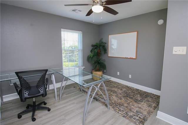 office space featuring ceiling fan and light wood-type flooring