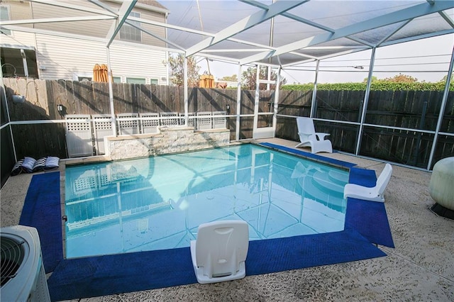 view of swimming pool with glass enclosure