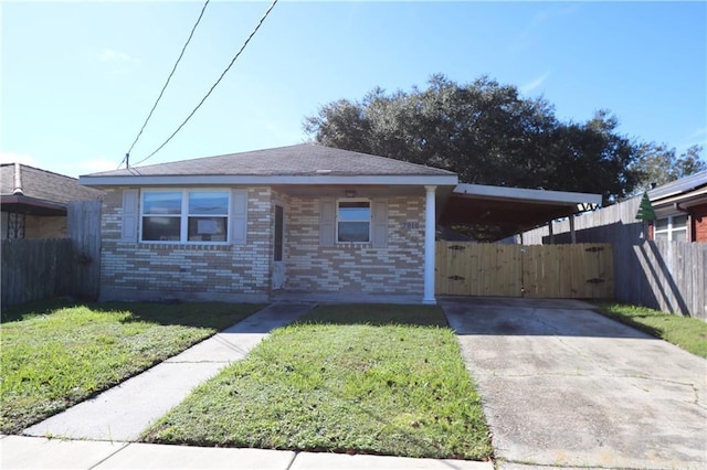 bungalow-style home featuring a front yard and a carport