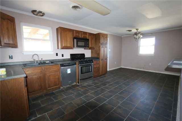 kitchen featuring appliances with stainless steel finishes, ceiling fan, crown molding, and sink